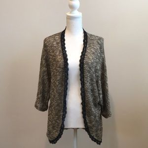 Daytrip Dolman sleeve shrug. Black lace detail